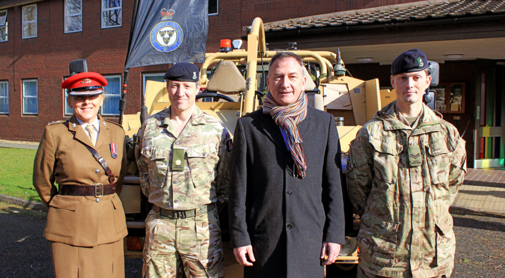 Photograph of Lt Col Sam Brettell (11 WM Signals Brigade), Major Richard Todd (Officer Commanding D Squadron RY), Paul Forsythe (SASH), and Cpl Tim Morgan (D Squadron RY)